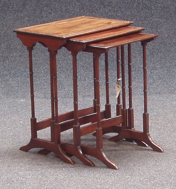 An Edwardian mahogany nest of three tables,