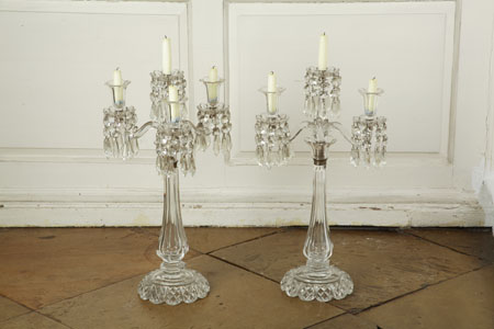 A pair of 19th century cut glass three branch candlebra