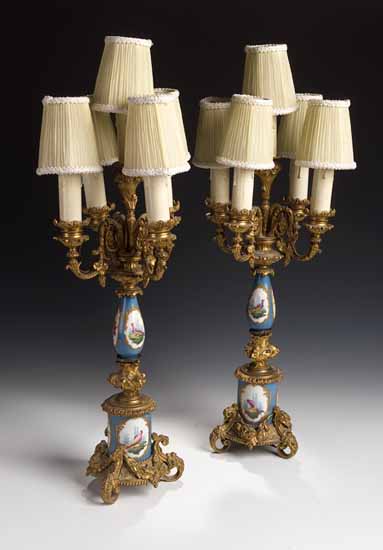 A pair of porcelain and gilt metal five