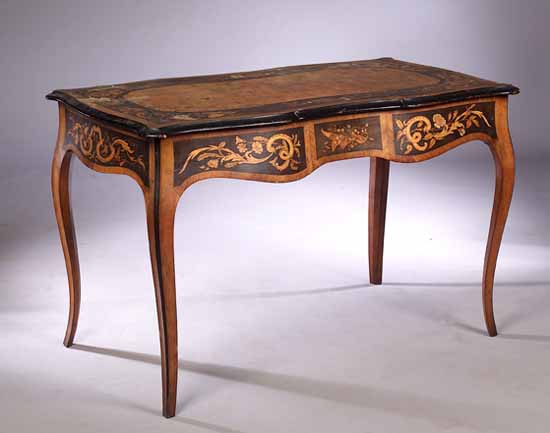 A 19th century walnut veneered and mahogany inlaid centre table