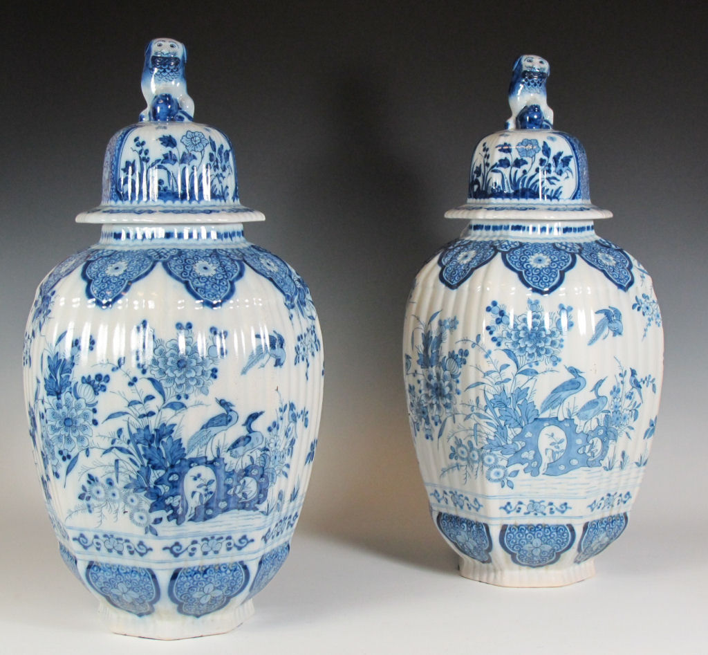 A pair of early 20th century French faience jars and covers