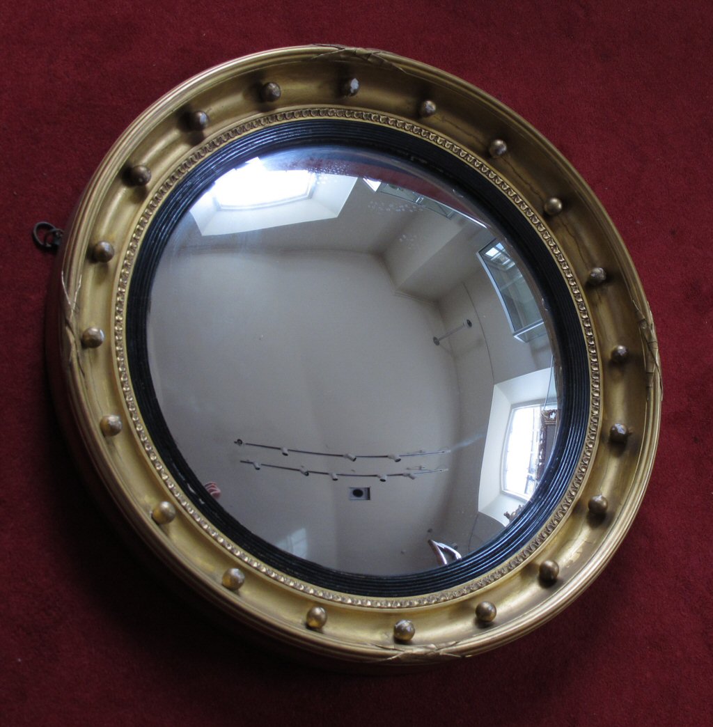 A Regency style giltwood convex mirror
