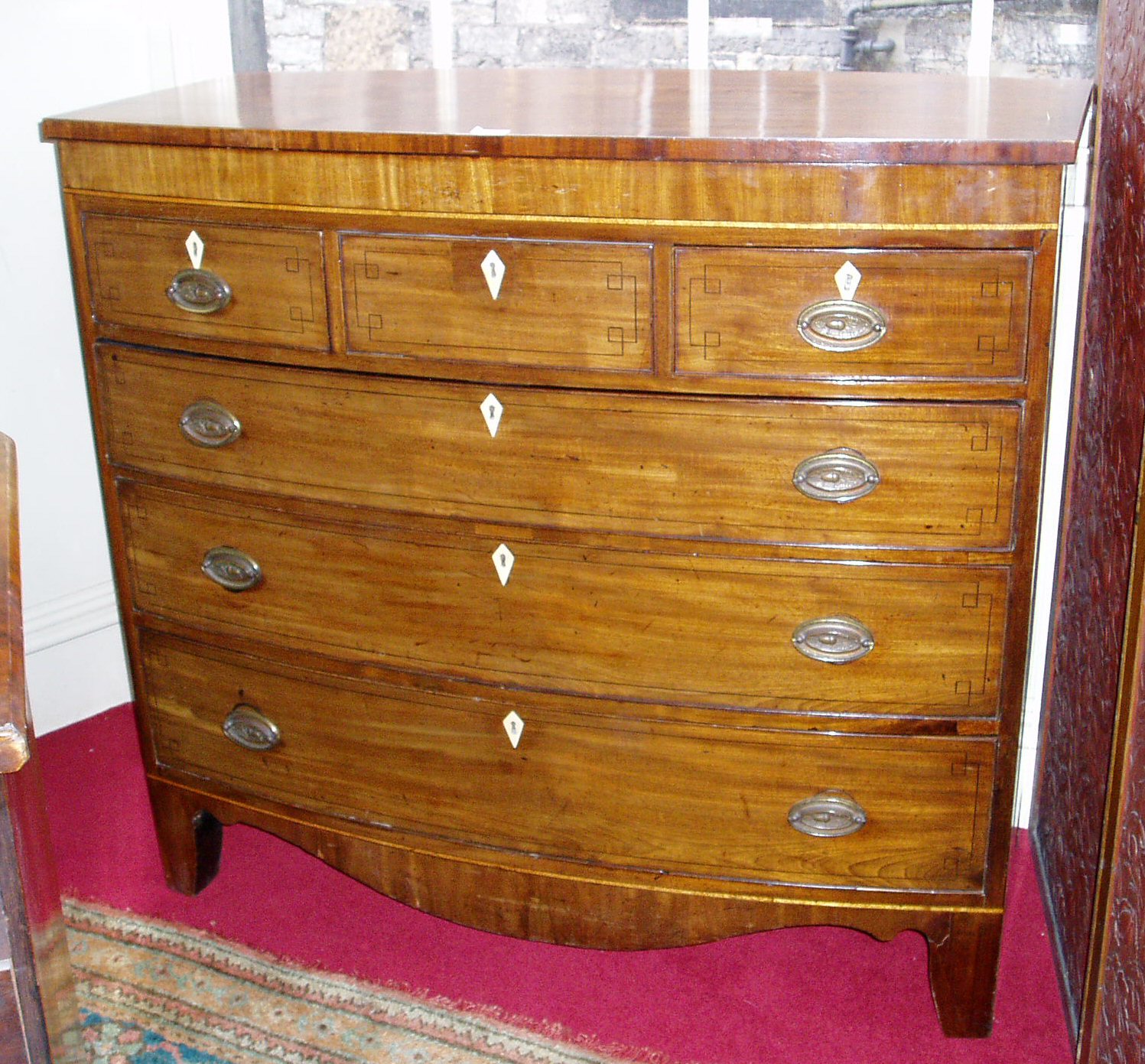 A mahogany bowfront chest of drawers,