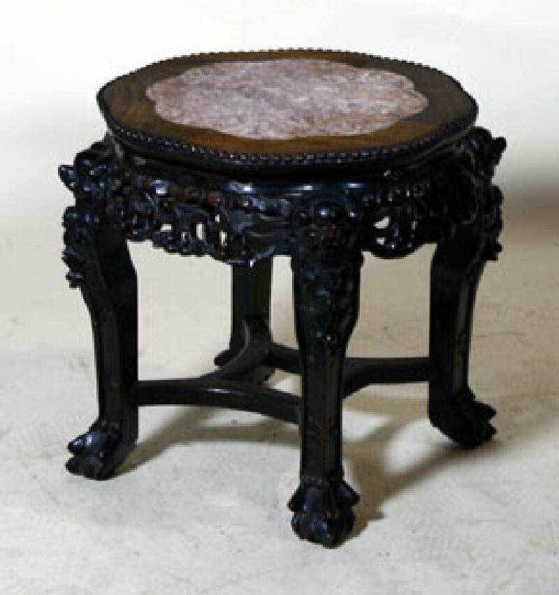 A Chinese hardwood marble top jardiniere stand