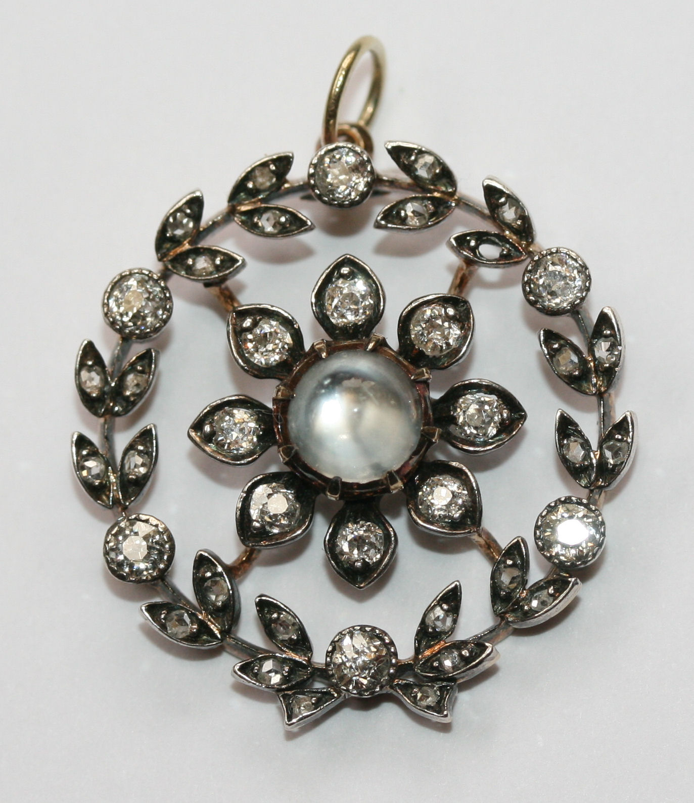 An early 20th century diamond and moonstone brooch