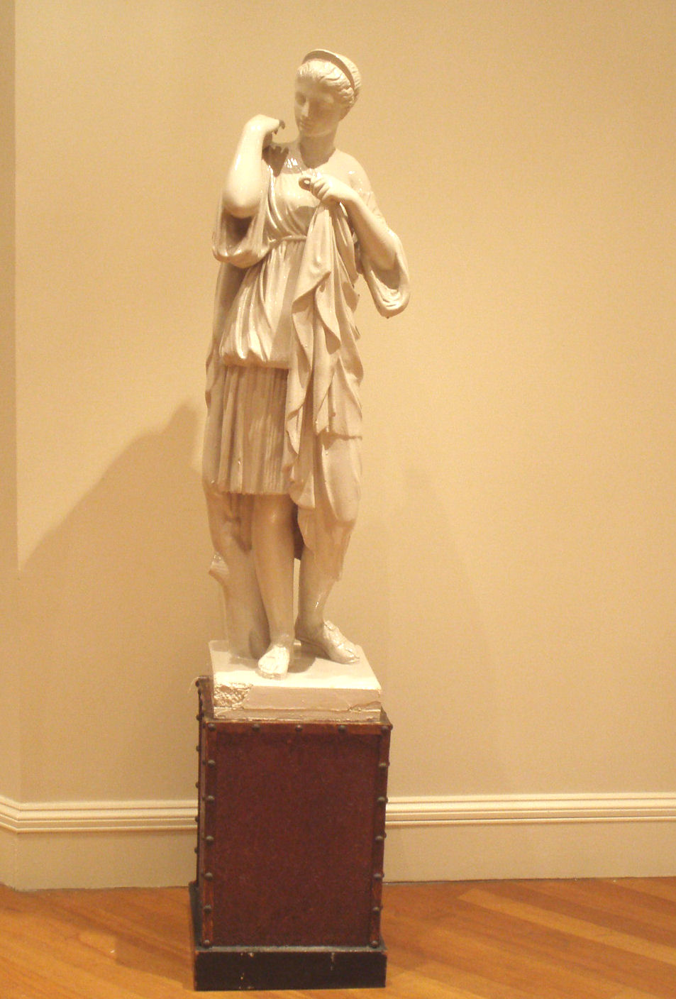 A large moulded plaster figure of a classical maiden