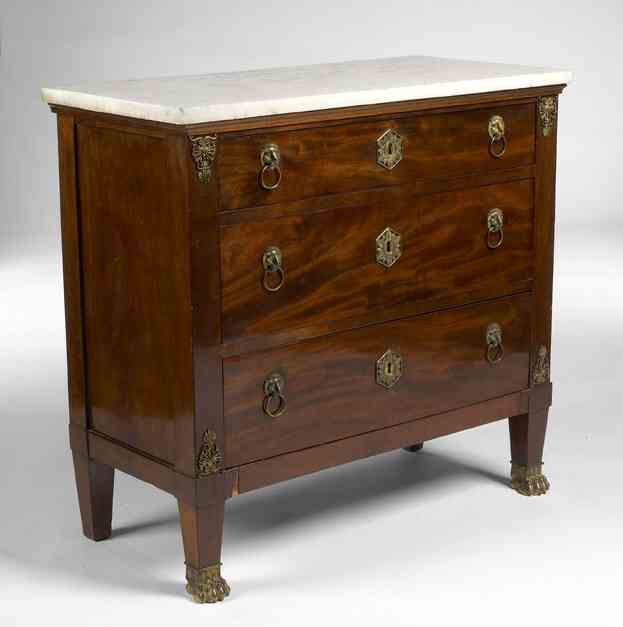 An early 19th century mahogany and marble topped chest In the Empire Taste, possibly Russian