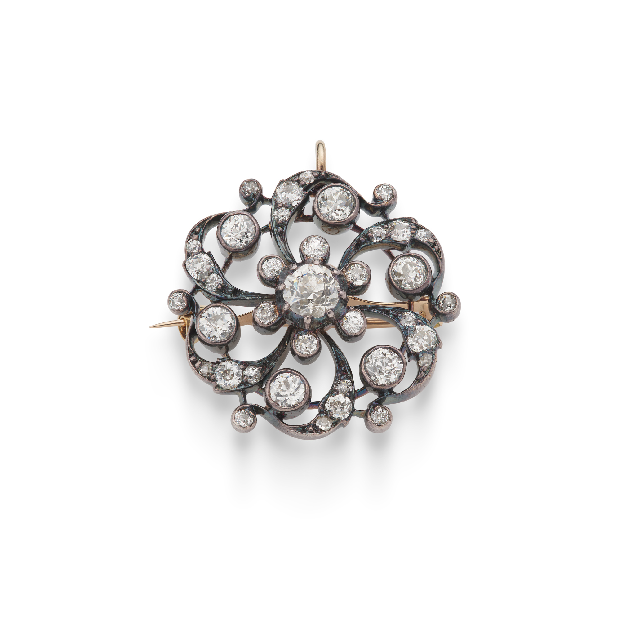 A diamond pinwheel brooch / pendant