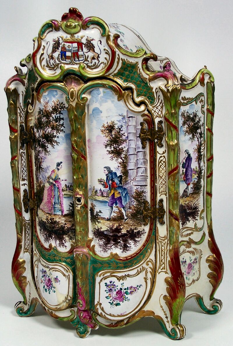 A 19th century French faience table cabinet