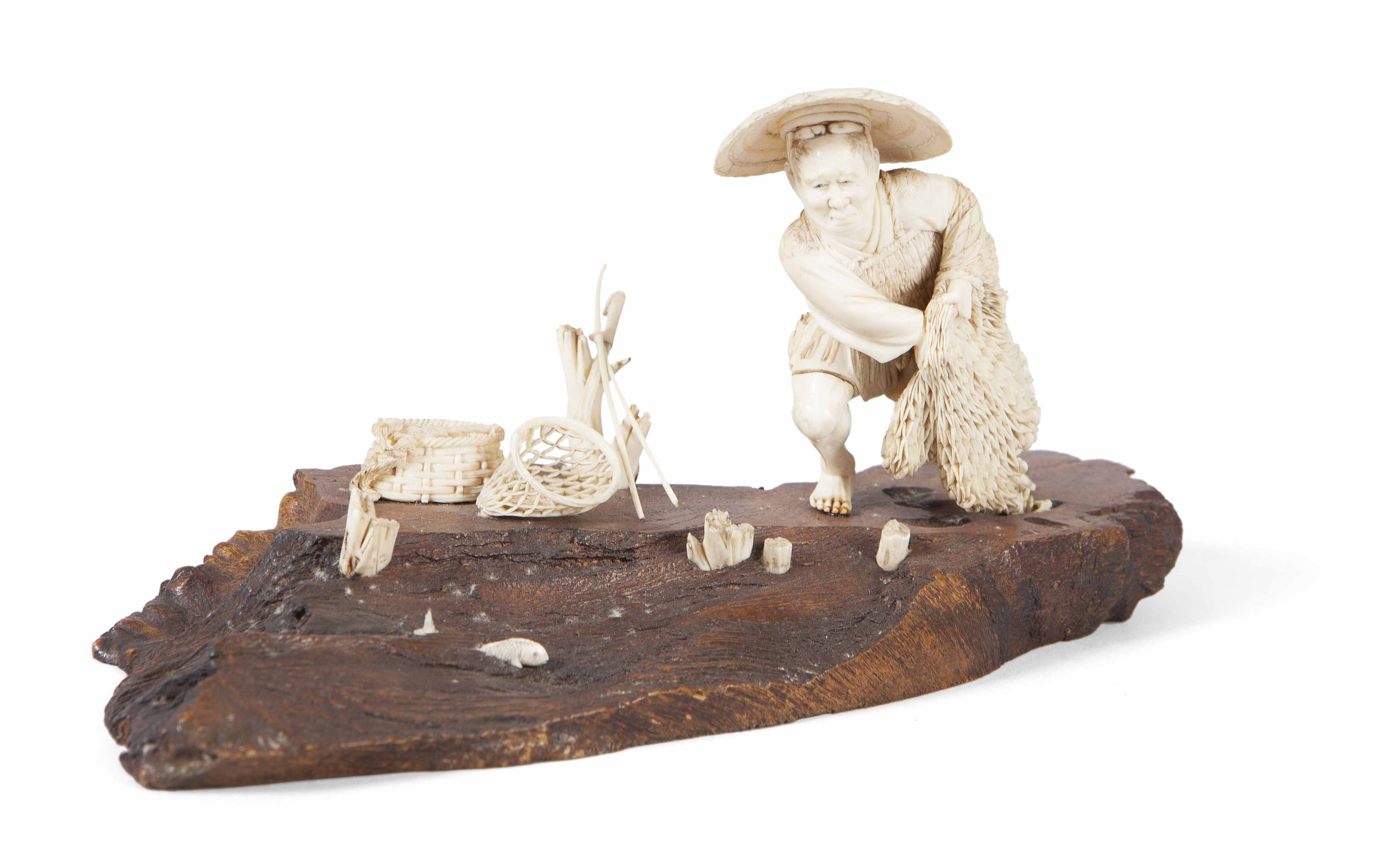 SMALL JAPANESE IVORY OKIMONO OF A FISHERMAN