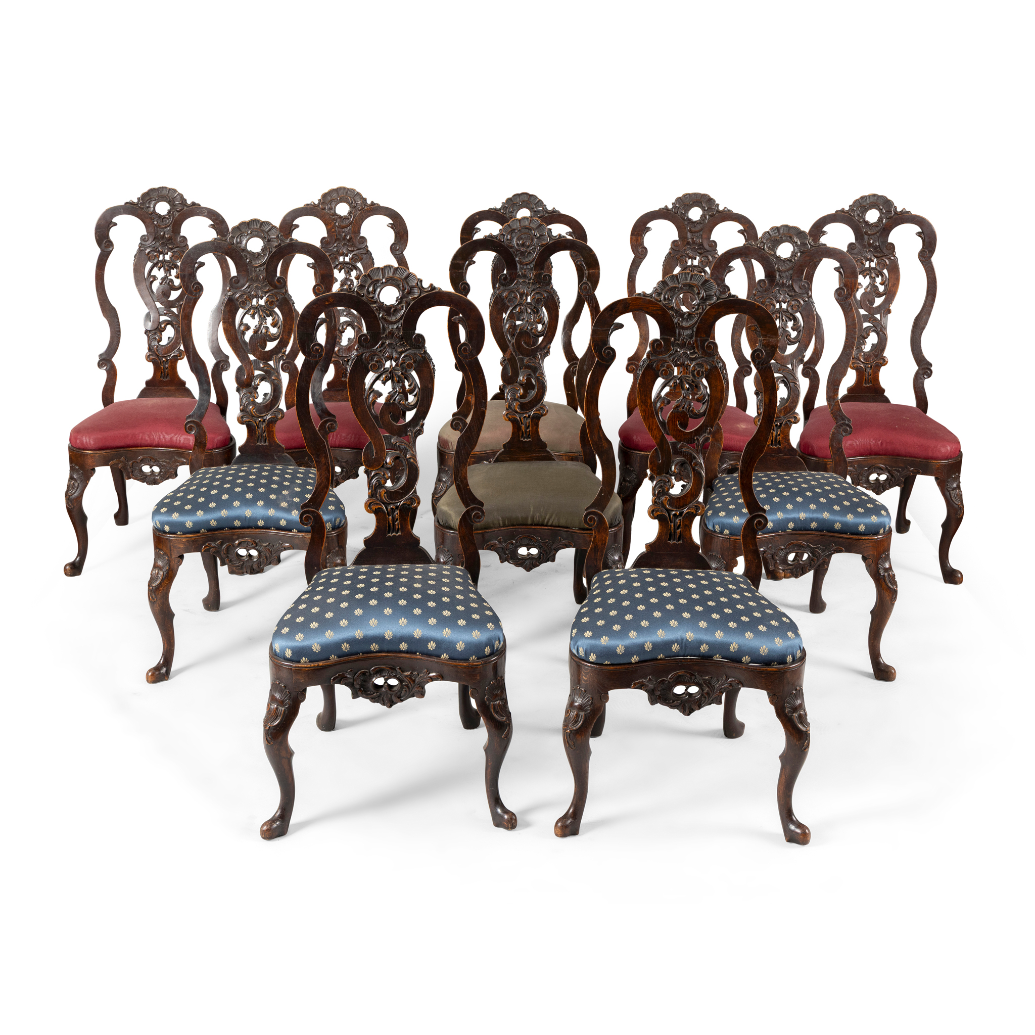 A SET OF TWELVE STAINED OAK DINING CHAIRS