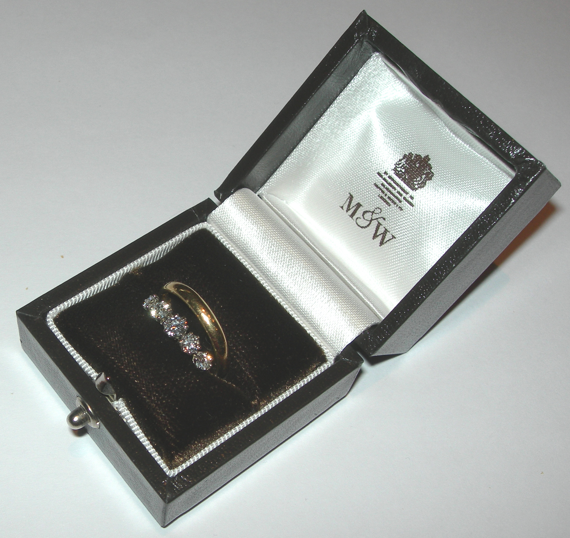 An 18ct gold and platinum mounted diamond five-stone ring,