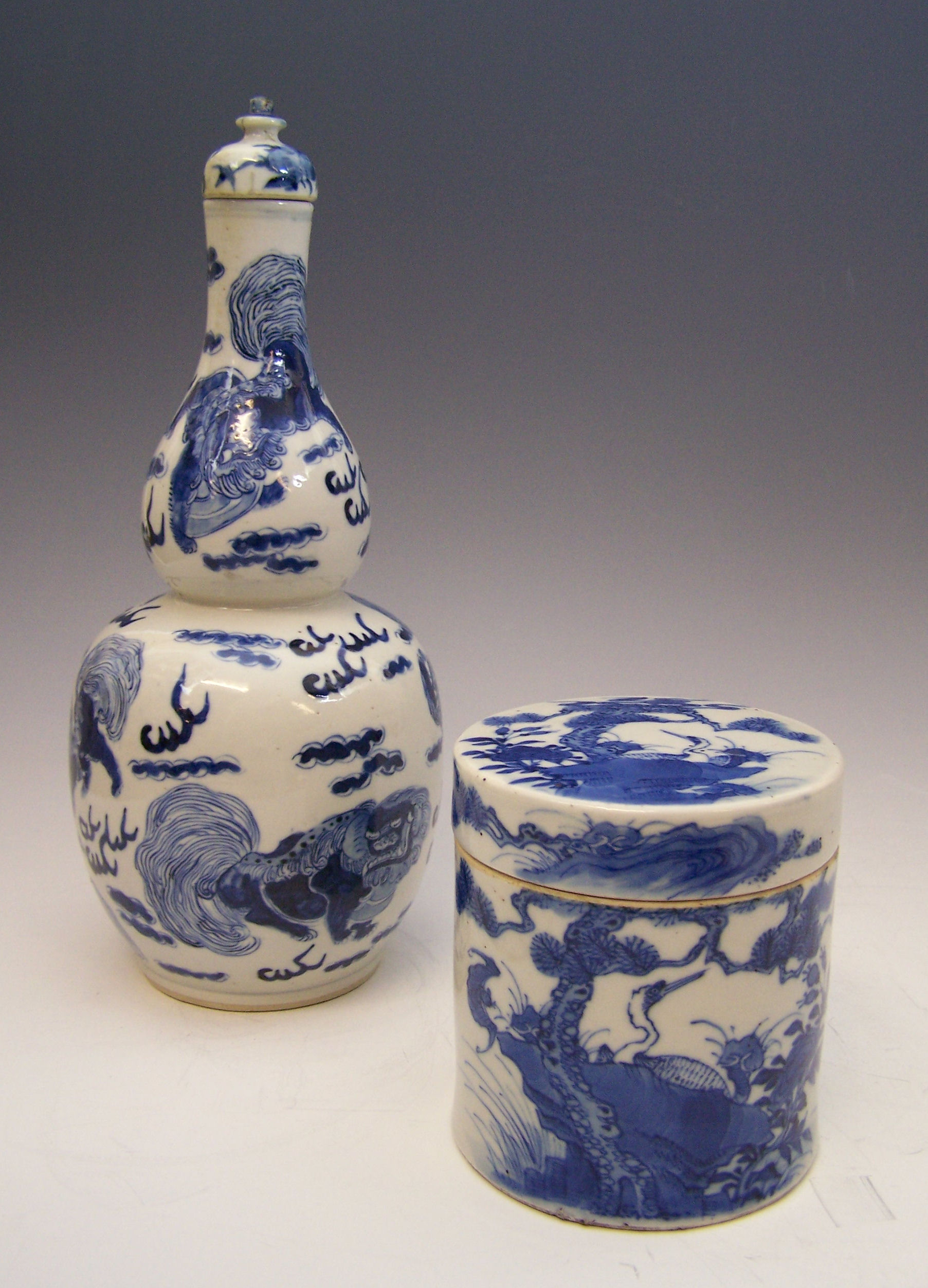 A Chinese blue painted double gourd vase and cover,