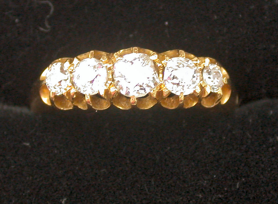 A Victorian gold mounted five stone diamond ring,