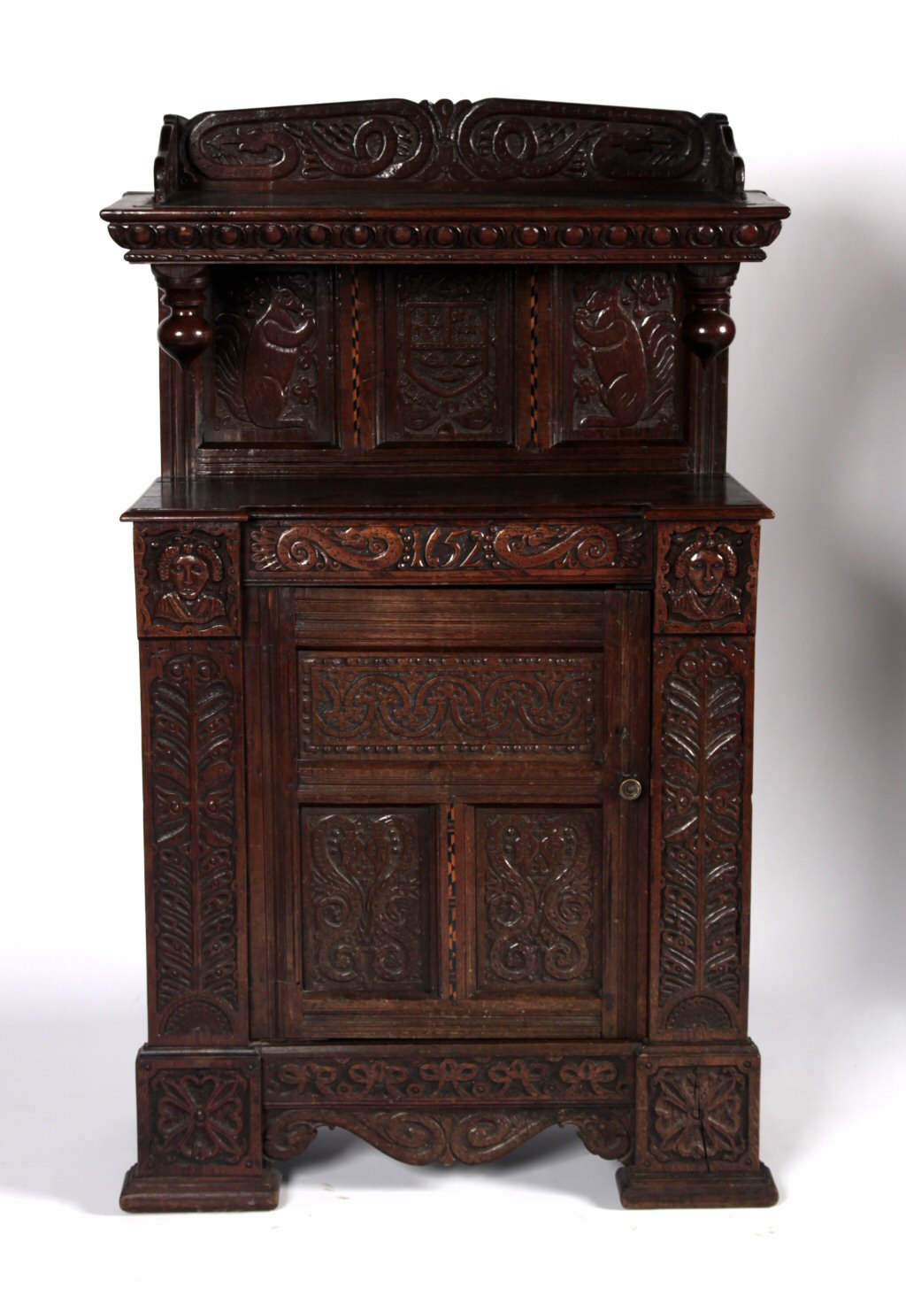 A 17th century composite oak court cupboard