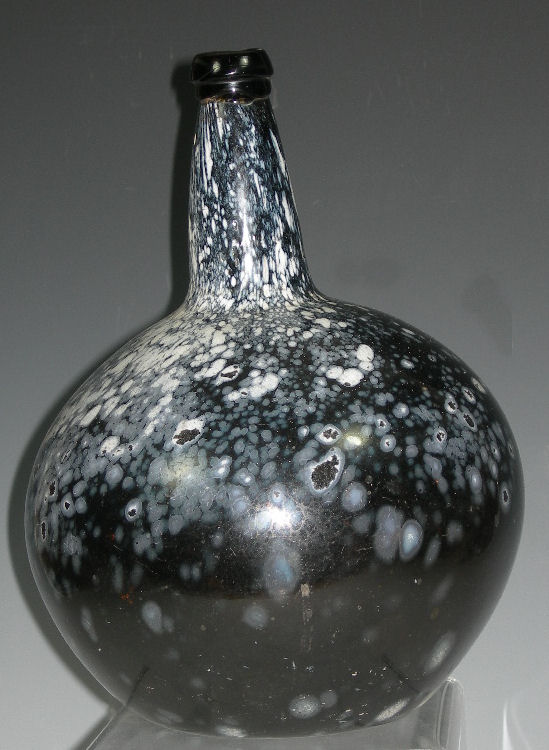 A 19th century brown glass onion shaped bottle
