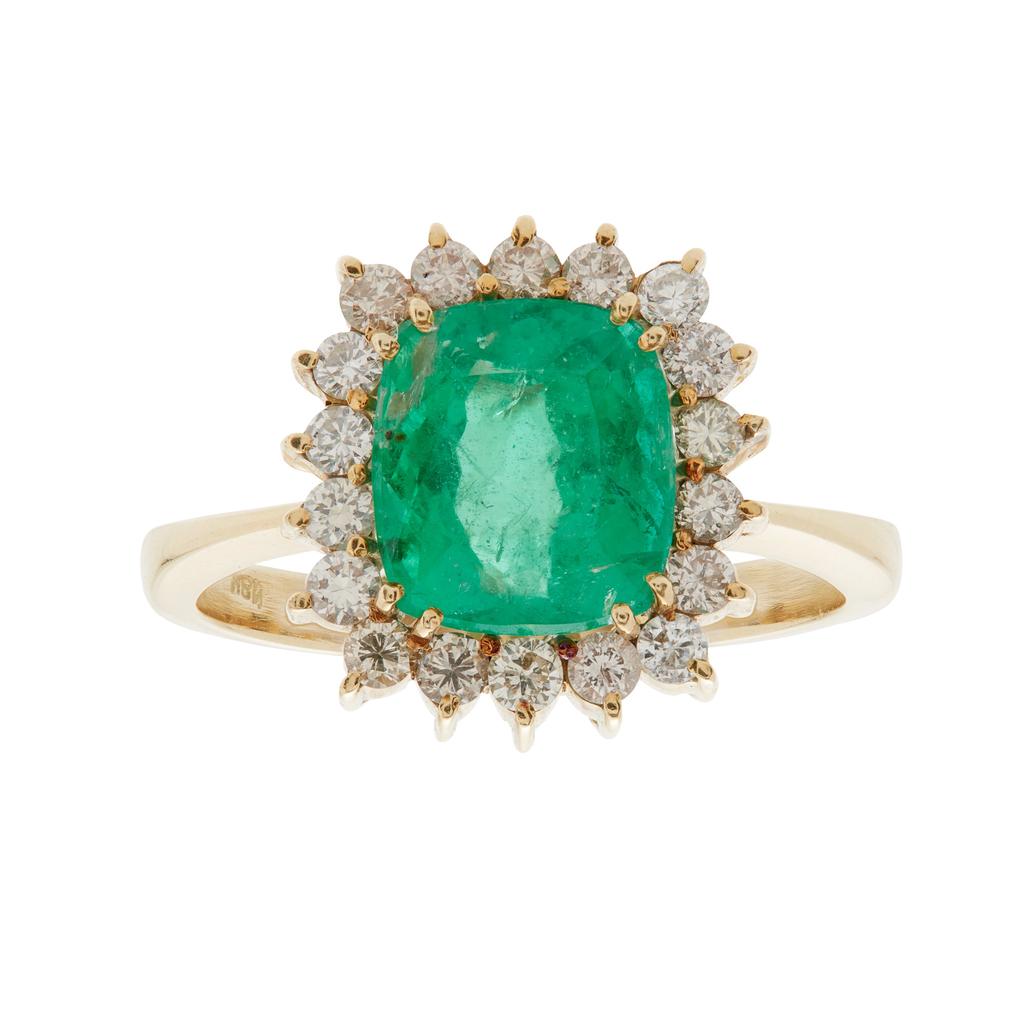 An emerald and diamond set cluster ring
