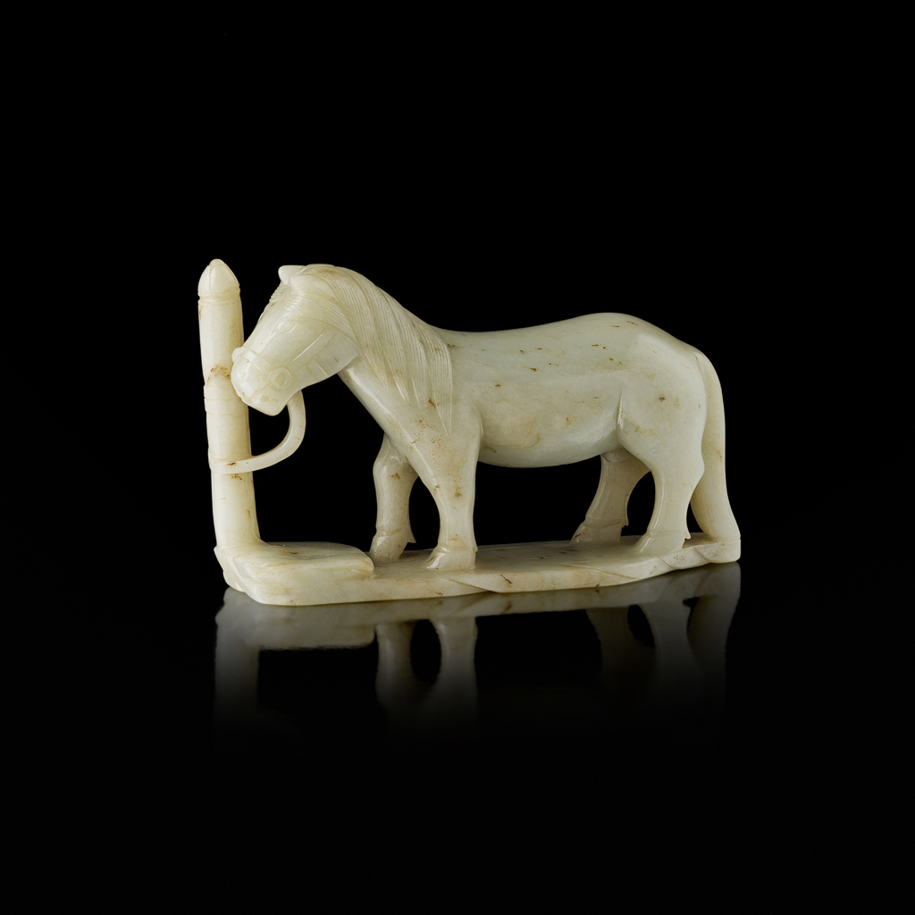 PALE CELADON JADE CARVING OF A TETHERED HORSE