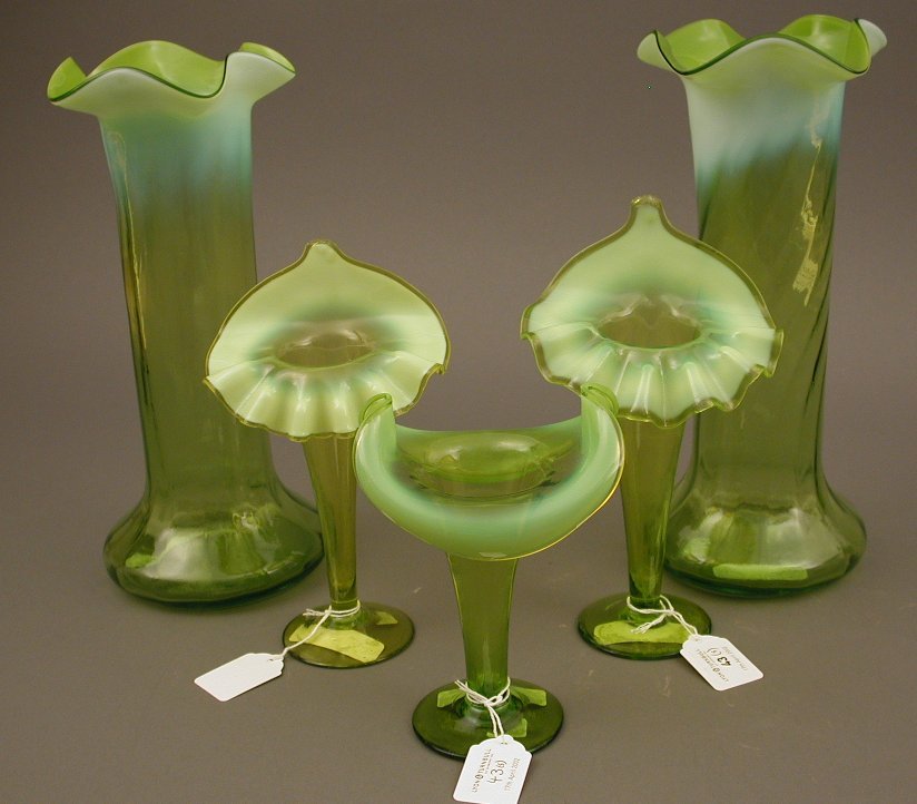 A collection of Art Nouveau green vaseline glass