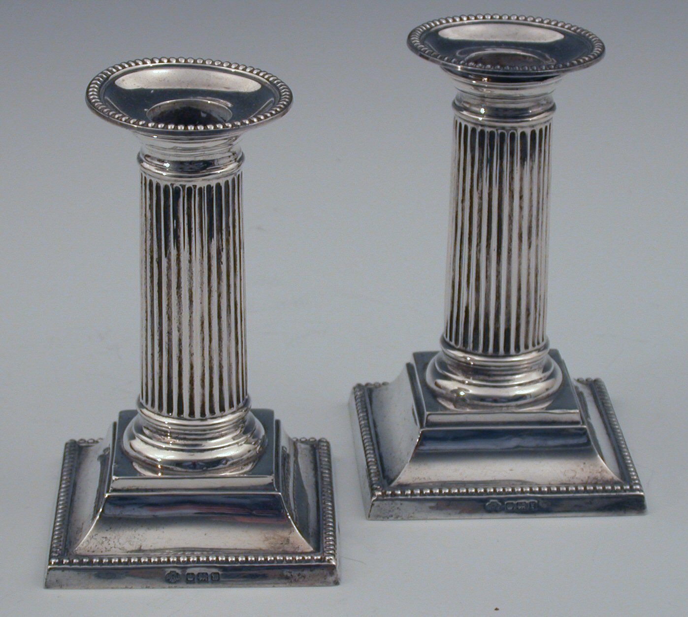 A pair of dwarf table candlesticks
