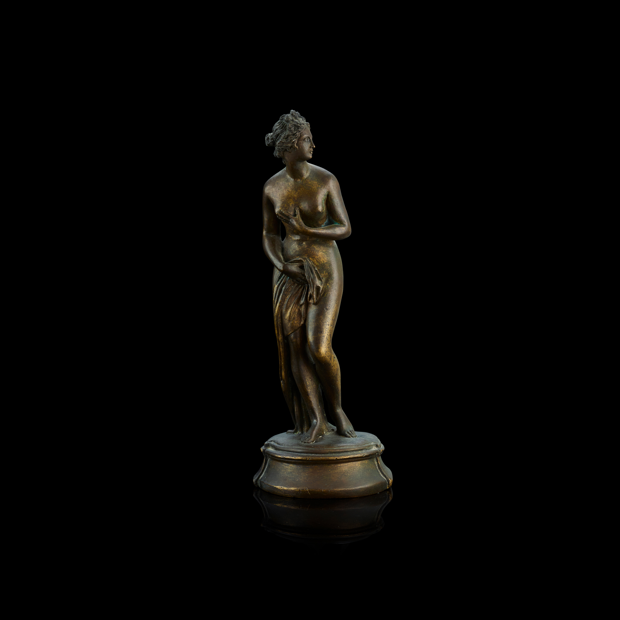 AN ITALIAN BRONZE FIGURE OF VENUS PUDICA