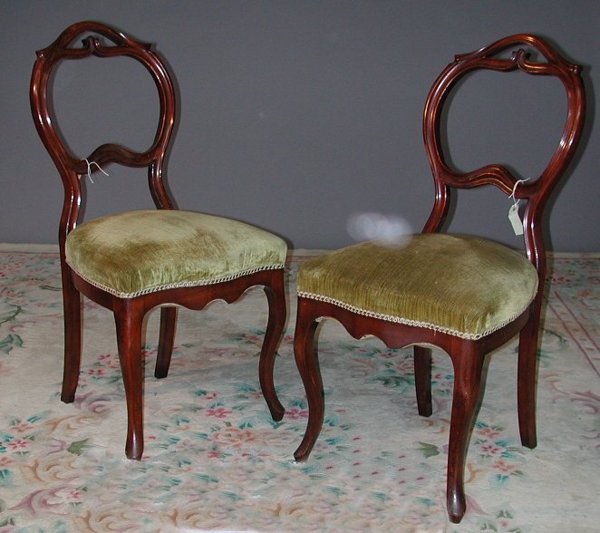 A set of six mahogany balloon back parlour chairs