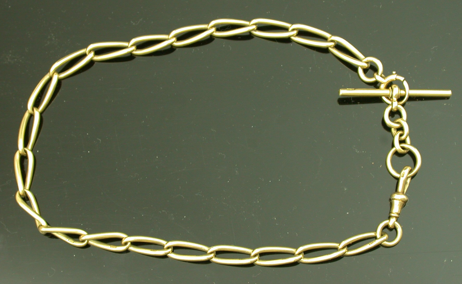 An 18ct gold curb link Albert chain,