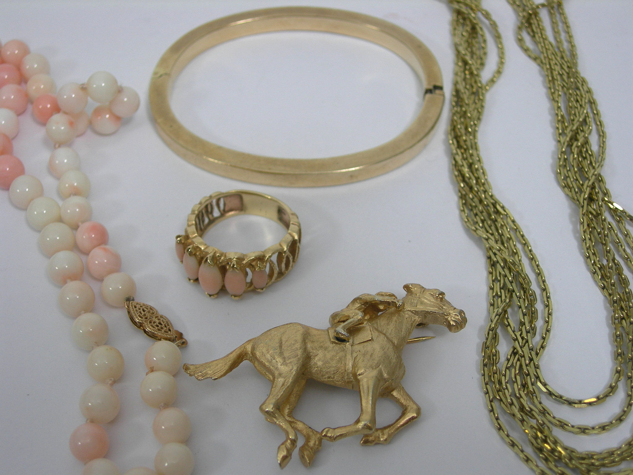 A 9ct gold hinged bangle,