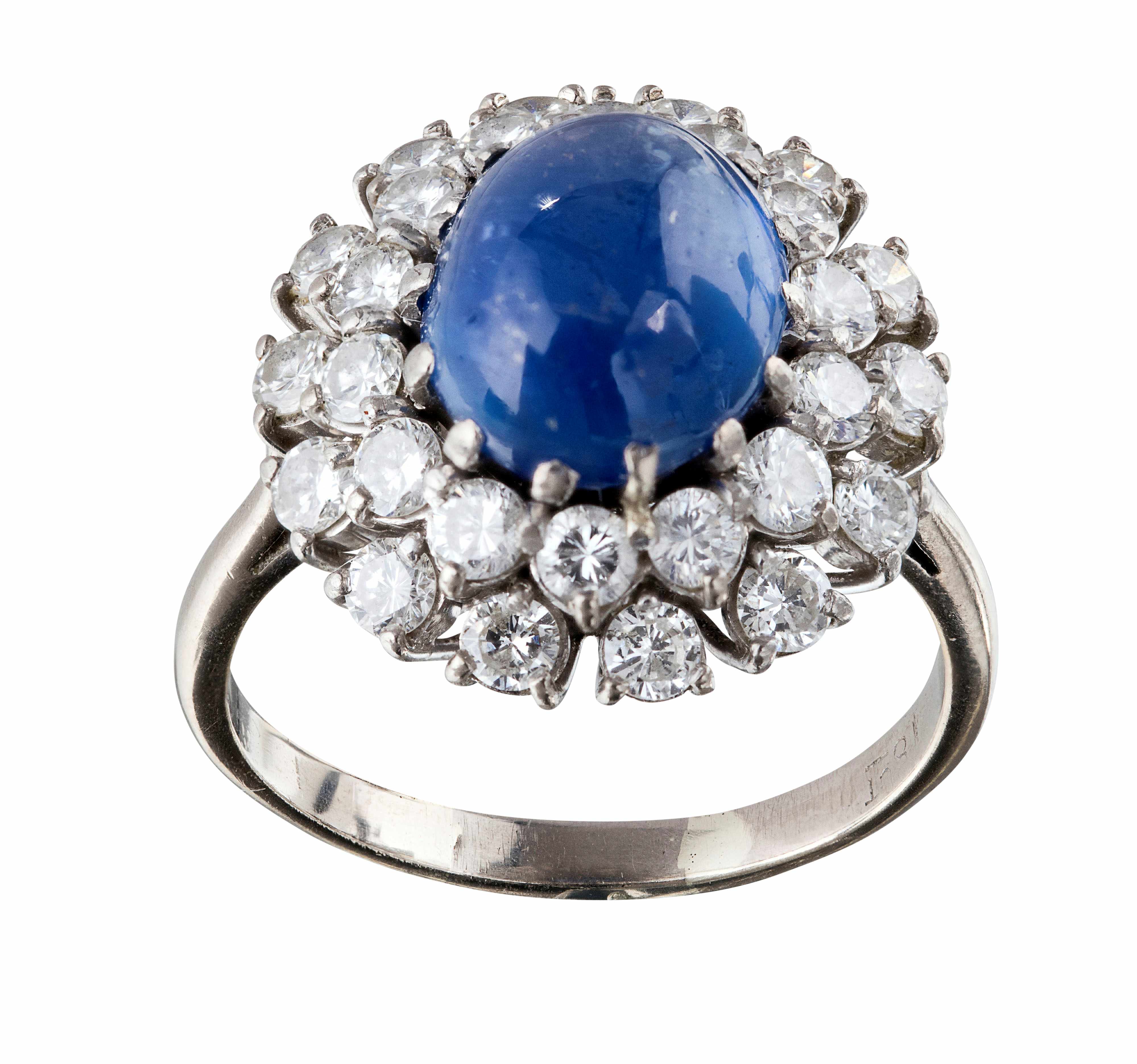 A cabochon sapphire and diamond set cluster ring