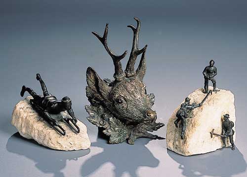 Three early 20th century bronzed figures of mountaineers