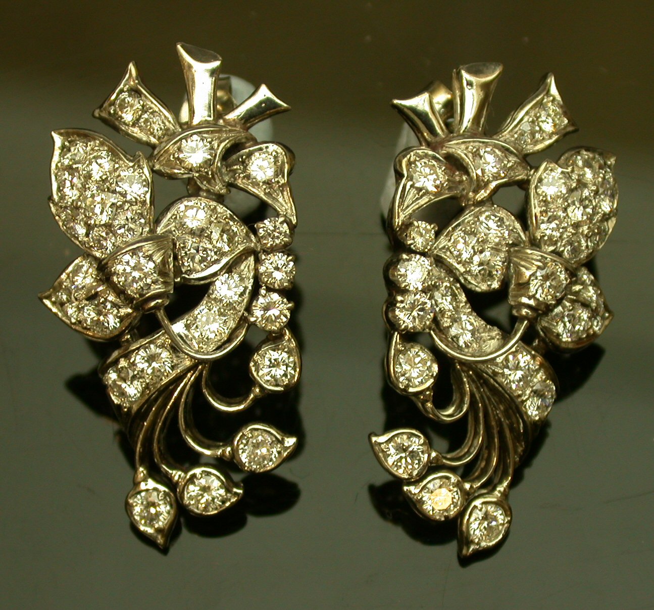 A pair of diamond cluster earrings,