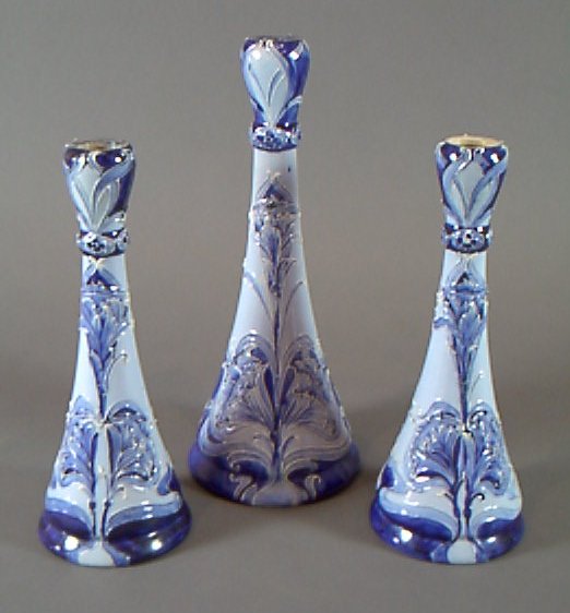 A Florian Ware candlestick garniture