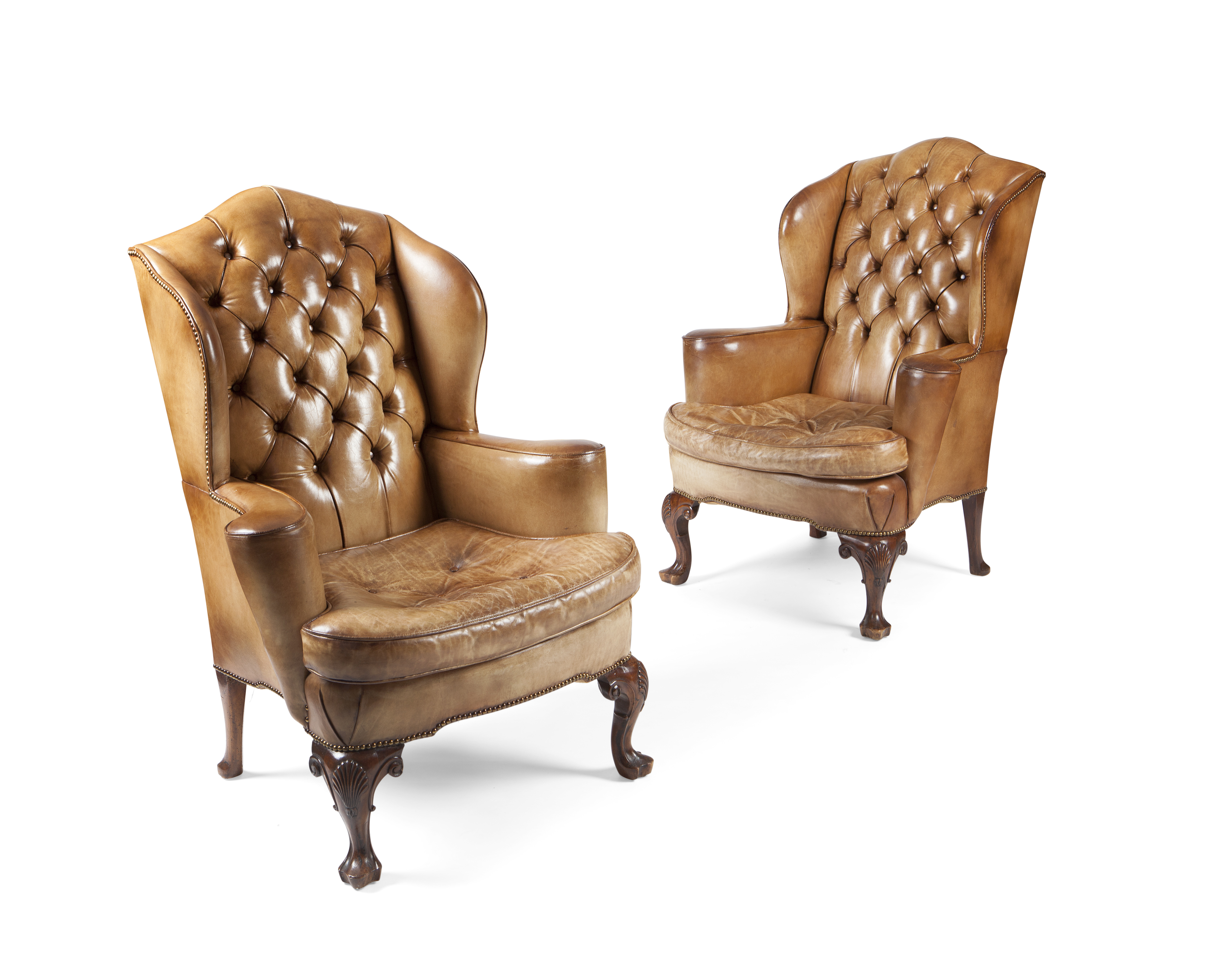 PAIR OF GEORGE II STYLE LEATHER UPHOLSTERED WING ARM CHAIRS