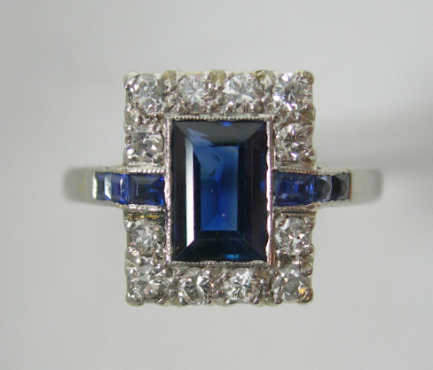 An 18ct gold and platinum mounted sapphire and diamond set ring,
