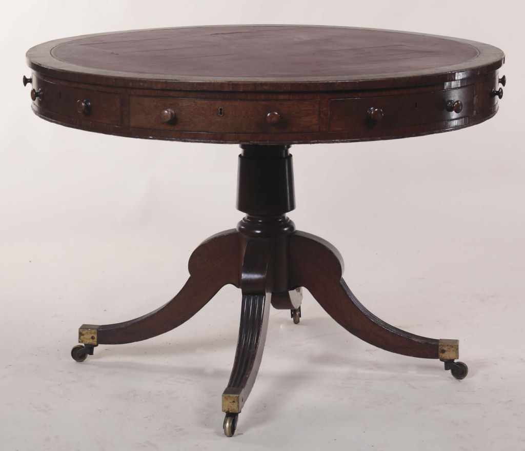 A 19th century oak drum table