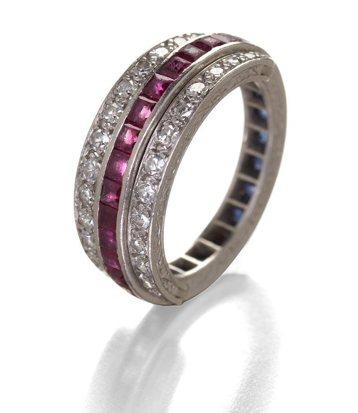 An Edwardian platinum mounted ruby, sapphire and diamond set eternity ring,