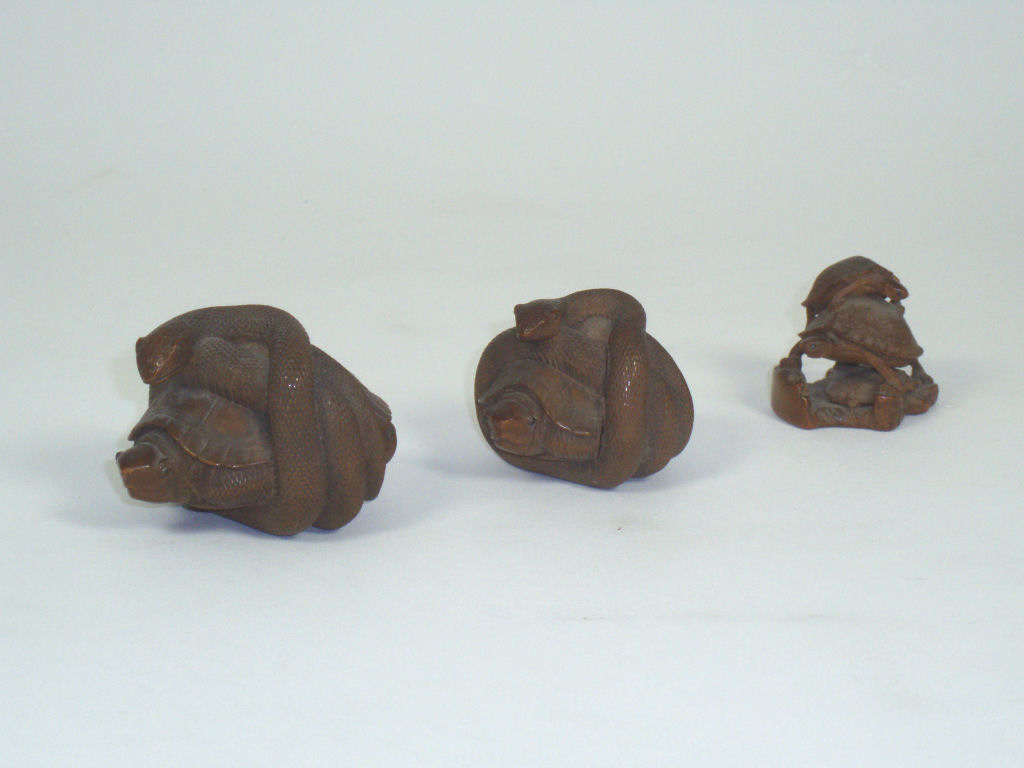 A graduated pair of Japanese wood okimono, Meiji period