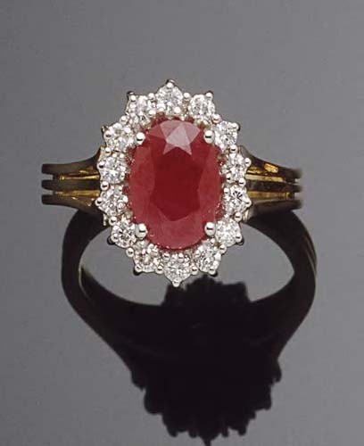 An 18ct gold mounted ruby and diamond cluster ring,