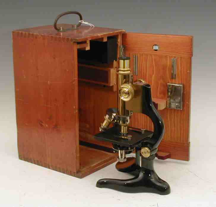 E Leitz, Wetzlar A brass and black lacquered steel monocular compound microscope,