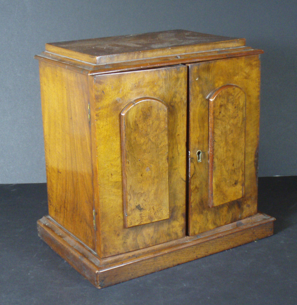 A 19th century walnut miniature collector's cabinet