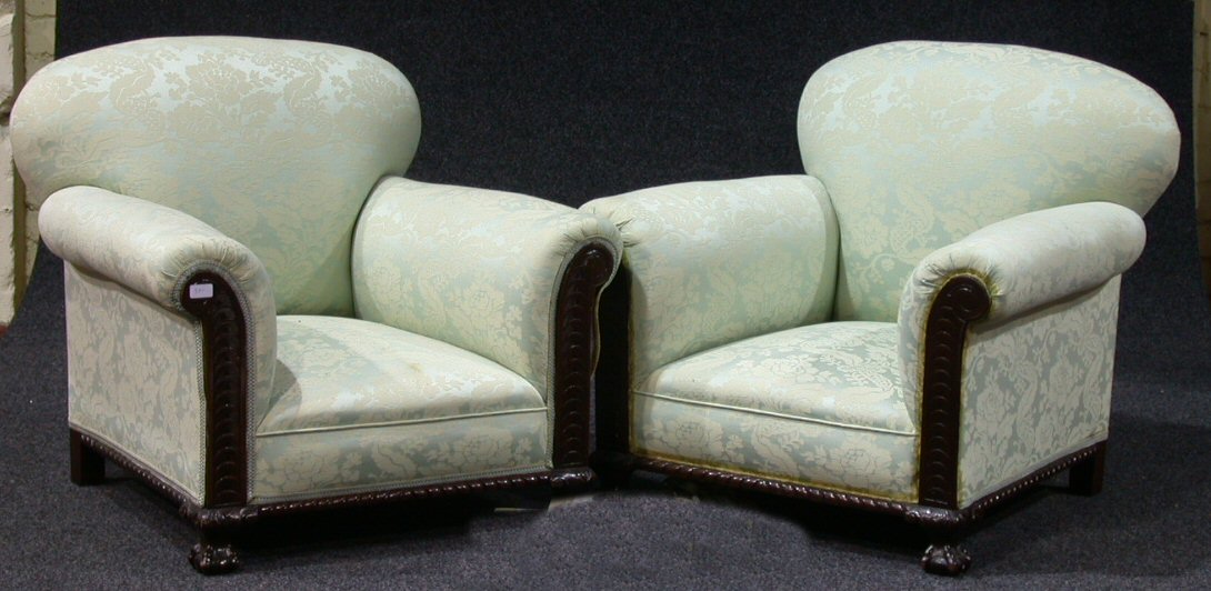 A pair of mahogany framed easy armchairs,