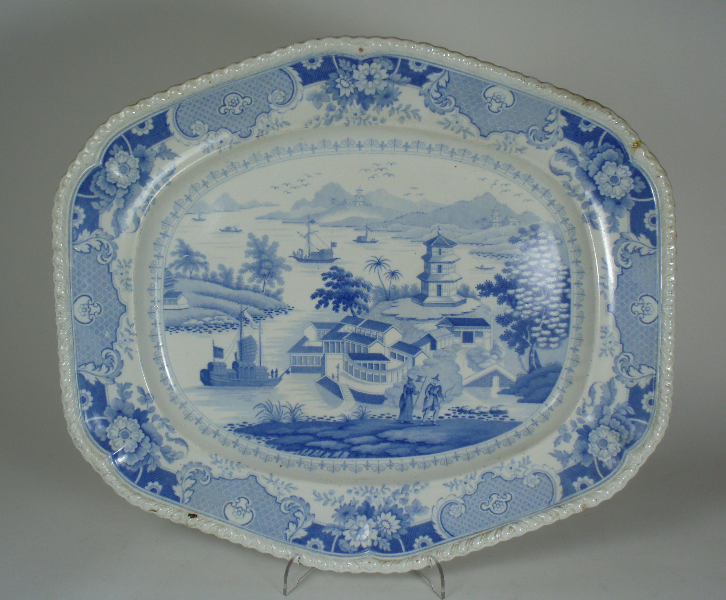 An early 19th century 'India Temple' pattern blue printed stone china ashet By John & William Ridgway