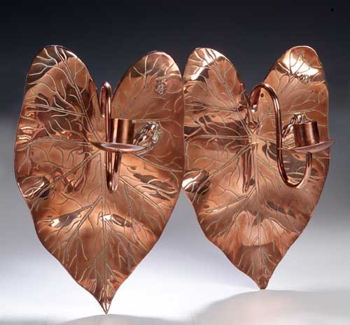 A pair of copper Aesthetic movement candle sconces