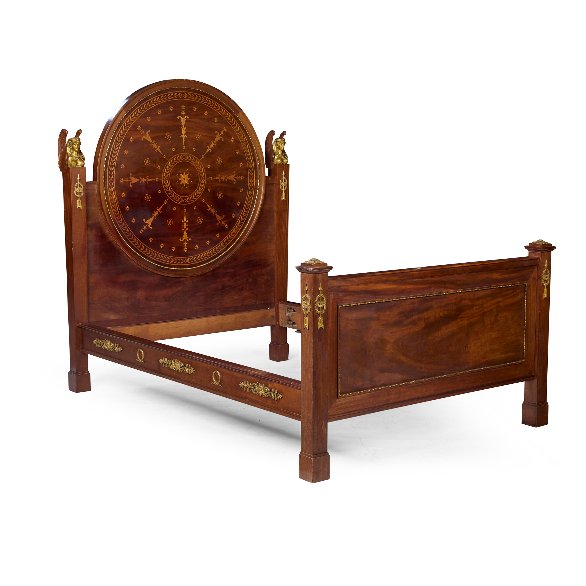 A FRENCH EMPIRE STYLE MAHOGANY AND MARQUETRY ORMOLU MOUNTED BED, MANNER OF MAISON DIEHL