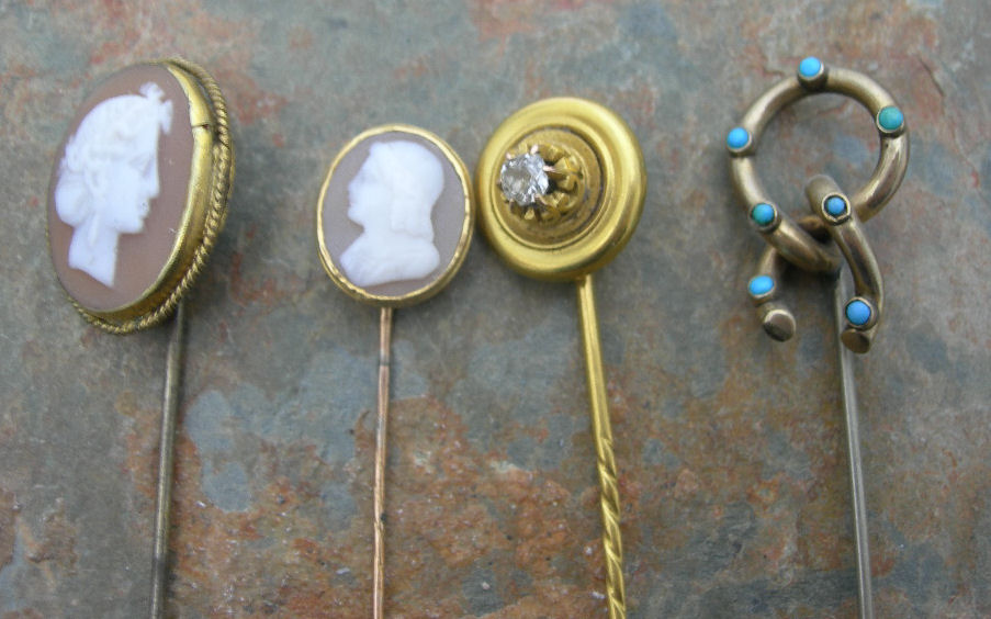 A COLLECTION OF TWENTY ASSORTED GEM SET STICKPINS,