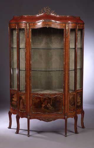 A French mahogany and gilt metal mounted bombe vitrine