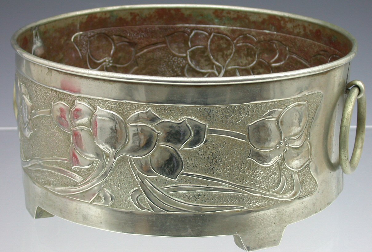 A Scottish School tin jardiniere,