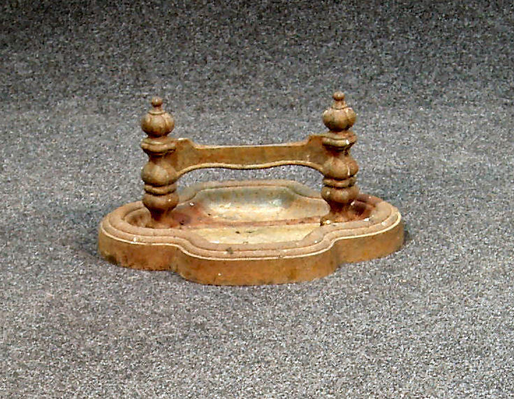 A cast iron footscraper;