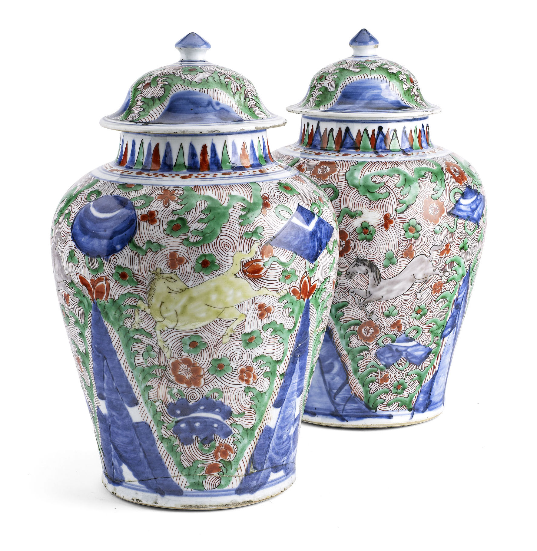 A pair of 17th century Chinese late Transitional porcelain jars and covers
