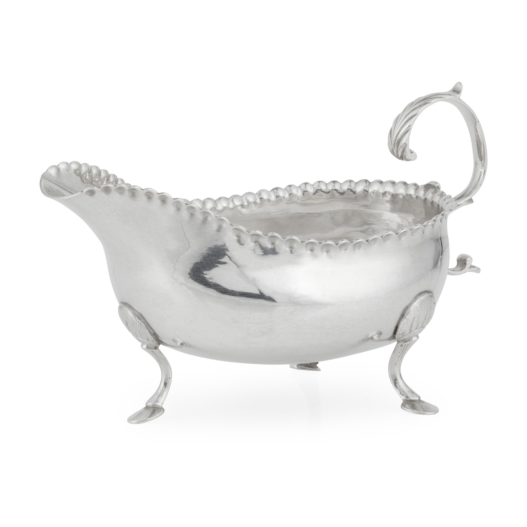 A GEORGE II ENGLISH PROVINCIAL SAUCEBOAT